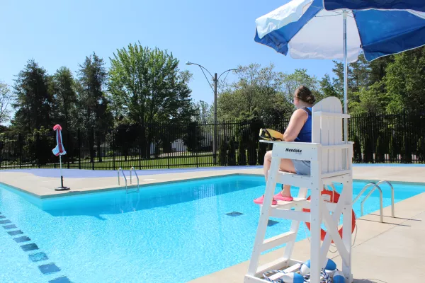 Lifeguard on chair at outdoor pool