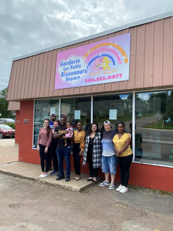 Garderie Les Petits Bisounours Daycare team standing outside 