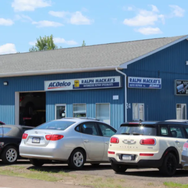 Business location, a large blue Building with garage doors.