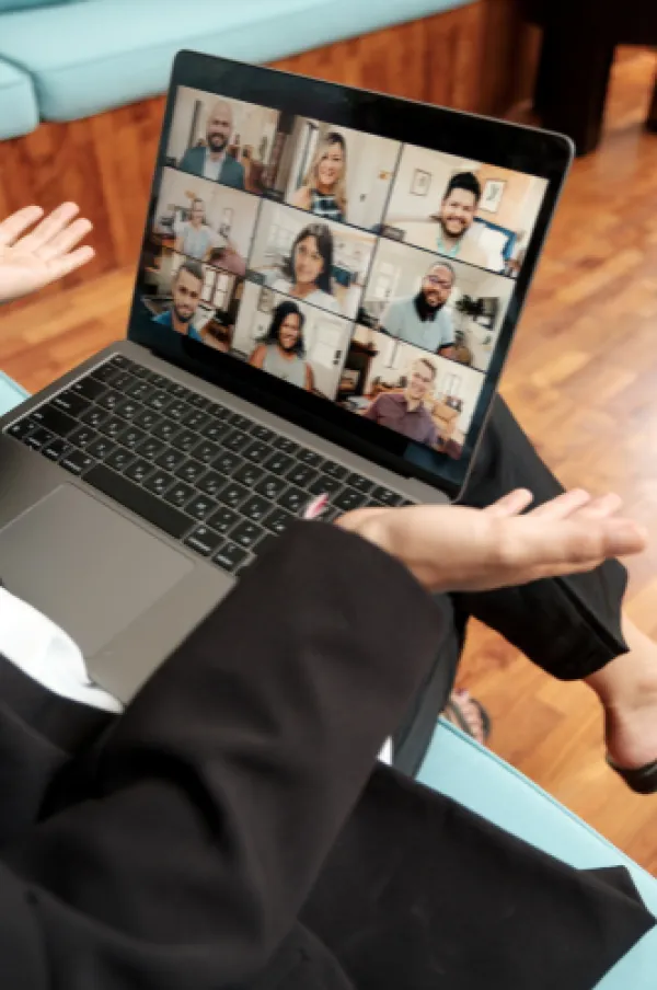 Woman attending group video meeting.